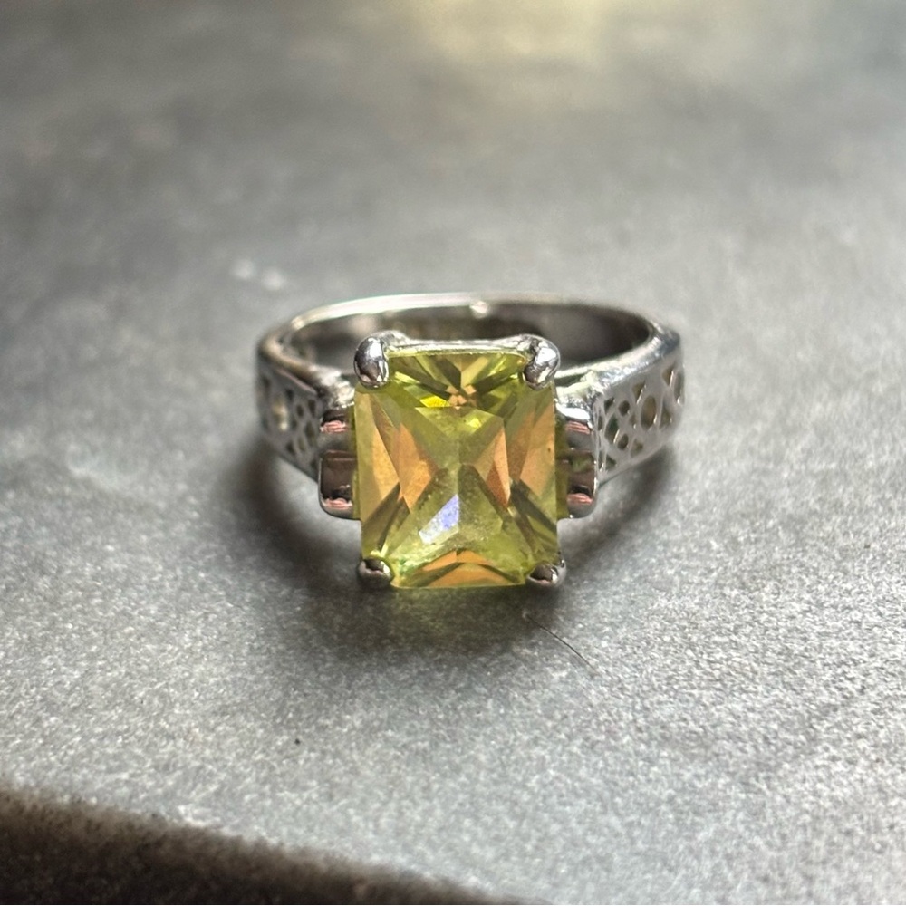 Radiant Silver Ring with Yellow Gemstone